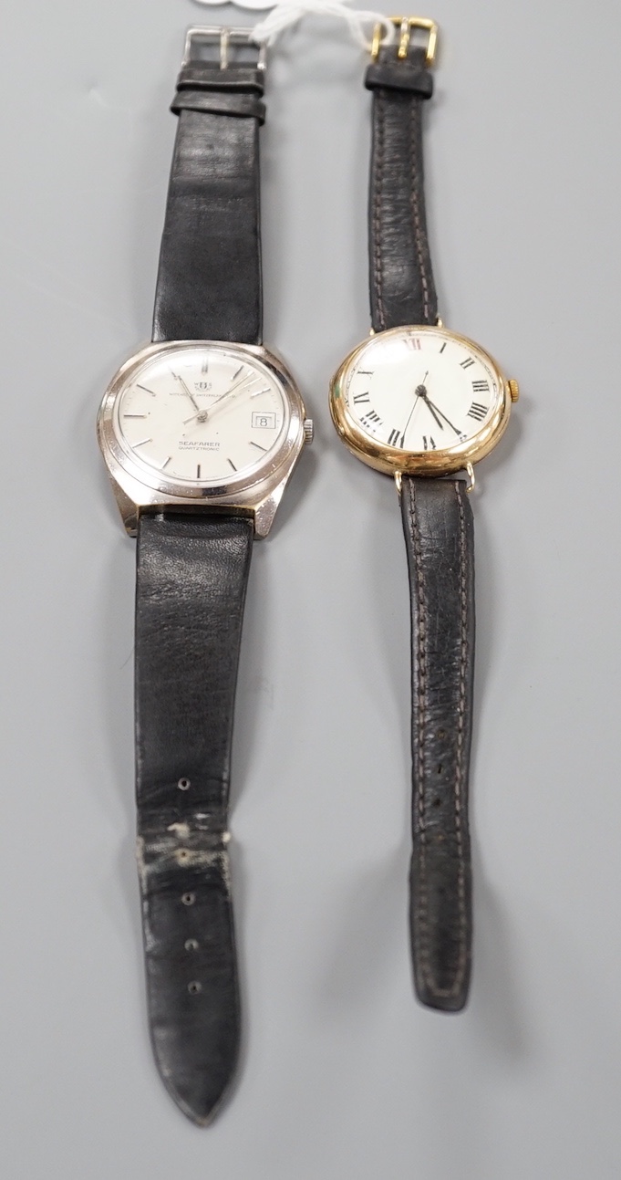 A gentleman's 1930' 9ct gold manual wind wrist watch, on a leather strap, 27.5 grams and a similar stainless steel Watches of Switzerland Seafarer Quartztronic watch.